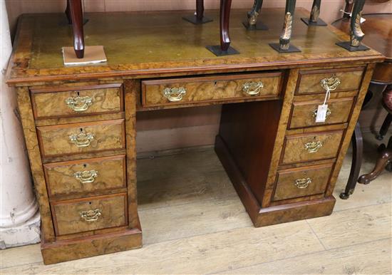 A late Victorian burr walnut nine drawer pedestal desk W.122cm